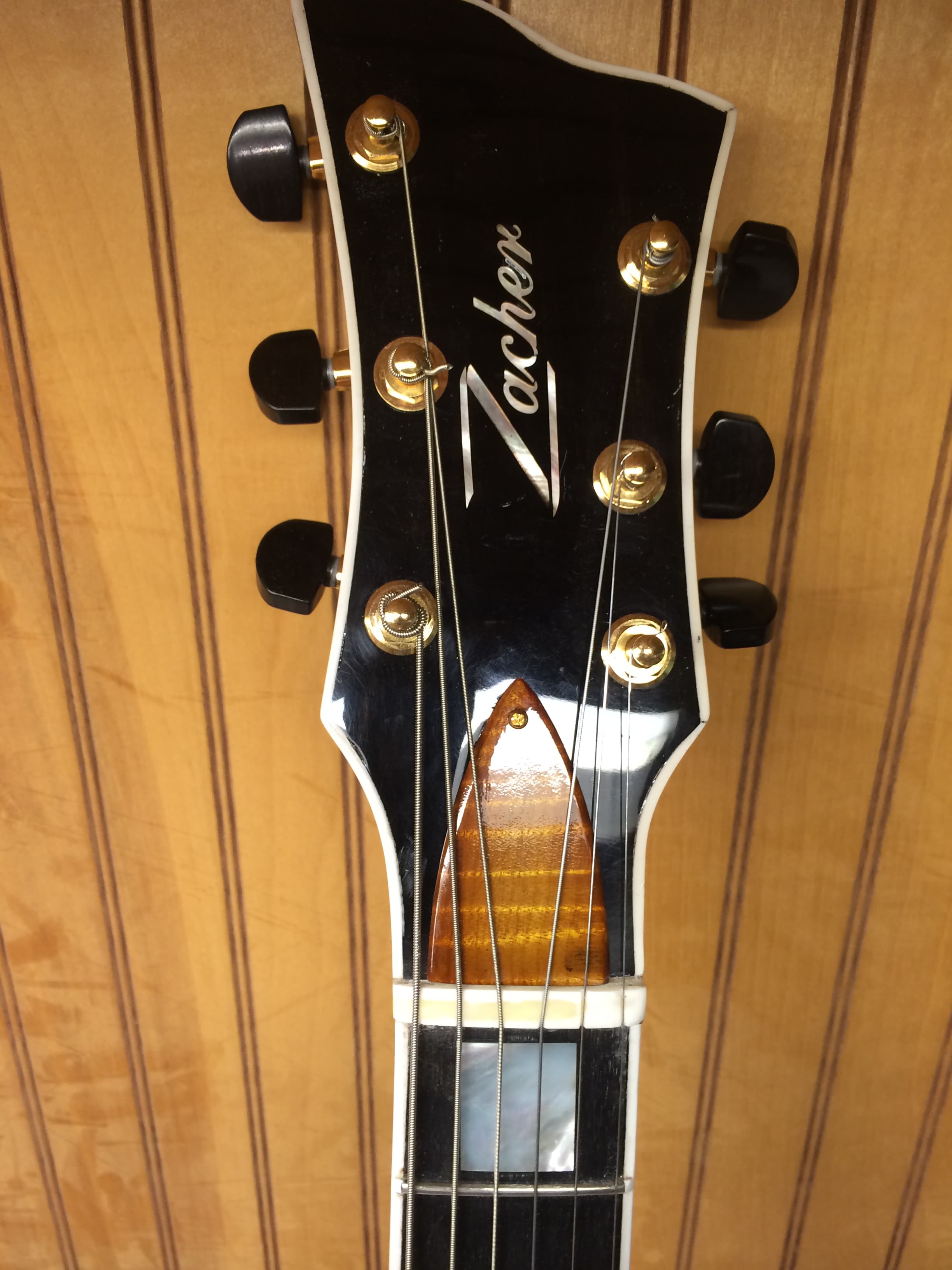 Black Headstock with Gold Tuners